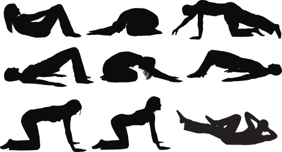 Fitness men and women doing yoga