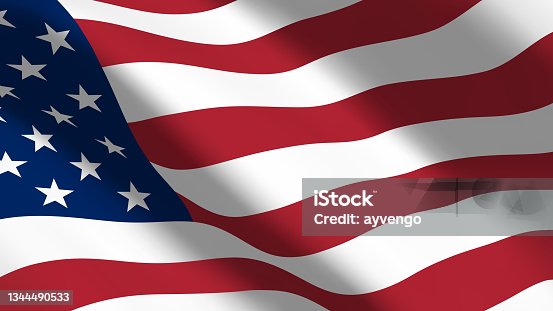 istock US flag flutters in the wind. USA flag with red and white stripes and stars on the blue part of the fabric closeup. Beautiful Americah Flag 1344490533