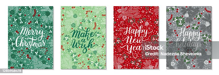 istock Floral Christmas red, green greeting card template vector set. Elegant spruce tree twigs, mistletoe leaves and berries, bunches of rowan pattern background. Hand-drawn Happy holidays lettering phrase 1285958478