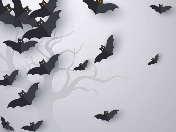 Flying bats background with copy space. Flying bats background with copy space. 3d paper cut style. Grey background with tree silhouette for Halloween holiday. Vector illustration. bat stock illustrations