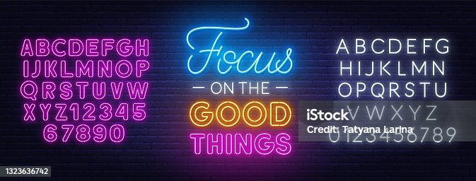 istock Focus on the Good Things neon lettering on brick wall background. 1323636742