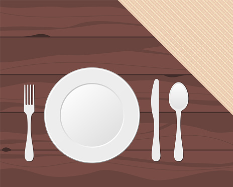 Fork, knife, spoon and plate on wooden texture with linen cloth. Cutlery, tableware, eating utensils.