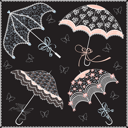 Four multi colored parasols on a black background