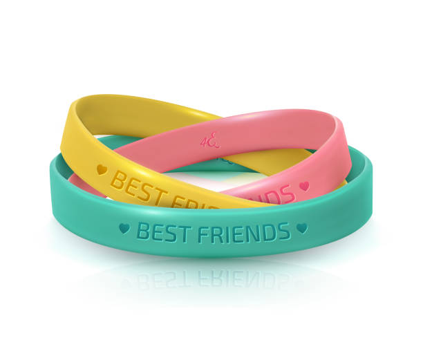 Friendship Day greeting card, happy holiday of amity. Three rubber bracelets for best friends: yellow, pink and turquoise. Silicone wristbands on white background. Friendship Day greeting card, happy holiday of amity. Three rubber bracelets for best friends: yellow, pink and turquoise. Silicone wristbands on white background. Vector illustration wristband stock illustrations