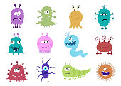 istock Funny and scary bacteria cartoon characters isolated on white background. 694906678