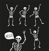Funny skeletons in different poses with speech bubbles. Vector elements for halloween design.
