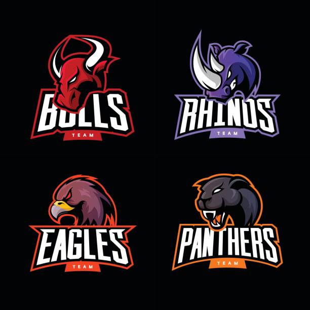 Furious rhino, bull, eagle and panther sport vector logo concept set isolated on dark background. Furious rhino, bull, eagle and panther sport vector logo concept set isolated on dark background.  bull animal stock illustrations