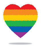 Vector illustration of a furry edged rainbow striped heart on a white background.