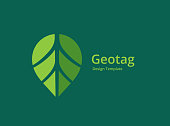 istock Geotag with eco leaves or location pin logo icon design 1173267870