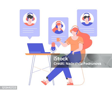 istock Girl in headphones at home or in the office at a desk with a laptop and a microphone. 1213492723
