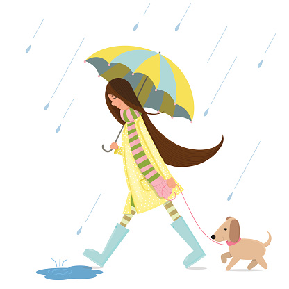 A girl is walking with a dog
