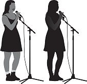 Vector silhouette of a girl singing into a microphone with a microphone stand.