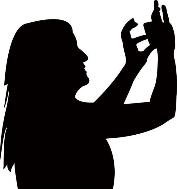 Girl taking selfie silhouette vector Girl taking selfie silhouette vector selfie silhouettes stock illustrations