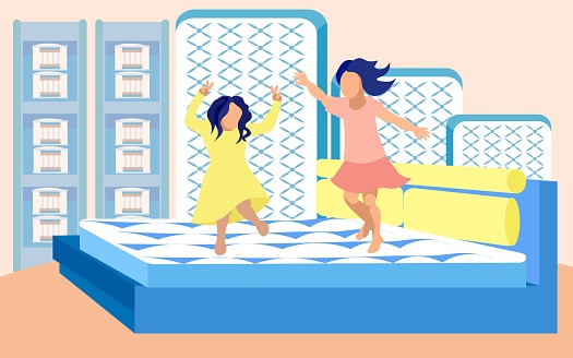 Girls Fooling Around on Bed in Mattresses Store