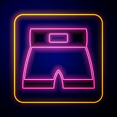 istock Glowing neon Boxing short icon isolated on black background. Vector 1359079920