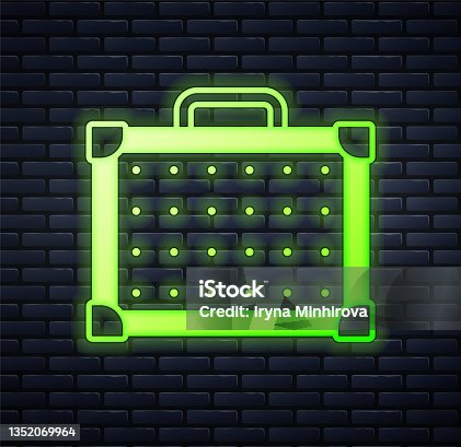 istock Glowing neon Guitar amplifier icon isolated on brick wall background. Musical instrument. Vector 1352069964