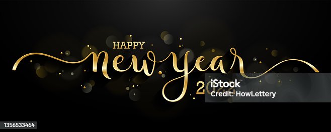 istock HAPPY NEW YEAR 2022 gold brush calligraphy banner on dark background 1356533464