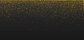 Loose golden glitter on a black background. EPS10 vector illustration, global colors, easy to modify.