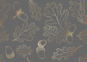 istock Gold oak leaves with acorn seamless vector 1367902589