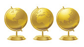 A golden navigation globe with a ​golden stand at 3 different angles.