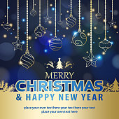 Celebrate the Christmas and New Year with shiny gold colored ornaments and elements on the blue background