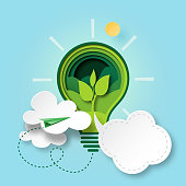 Paper cut of green ecology and environment conservation concept with seedling in light bulb and cloud bubble speech.Vector illustration.