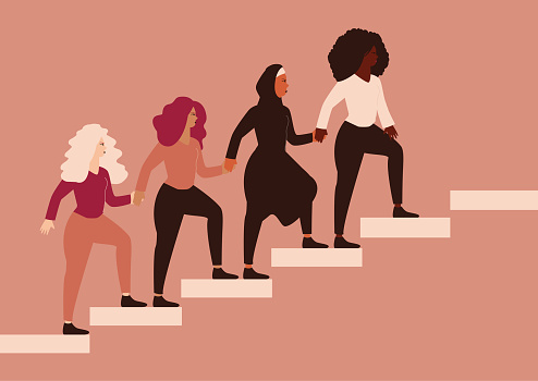 Group of strong women climbing highly on the stairs, hold hands, help each other. Females community with different ethnicity.