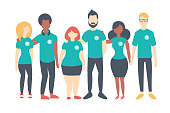 Group of Volunteers wearing same color t-shirts. Multinational people standing happily together. Vector flat isolated image