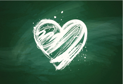 Grungy heart over green chalkboard