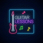 Guitar lessons glowing neon poster or banner template. Guitar training advertising flyer in neon style on dark brick wall background. Vector illustration.