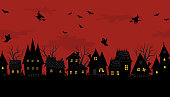 istock Halloween town. Creepy houses. Seamless border 1331834823