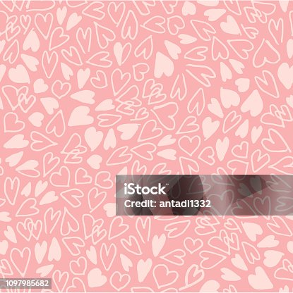 istock Hand drawn hearts seamless pattern. Simple chaotic light pink heart shapes on pink background. Flat vector texture. 1097985682