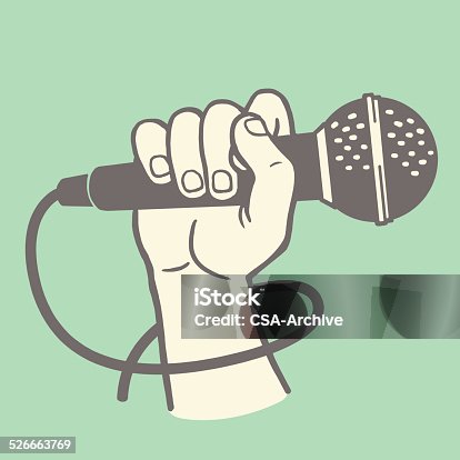 istock Hand Holding a Microphone 526663769