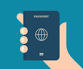 istock Hand Holding a Regular Passport 1339224763