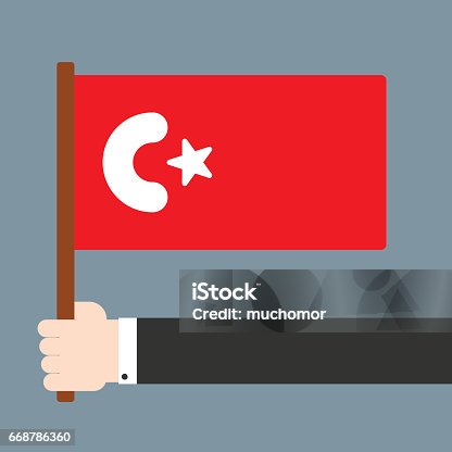 istock Hand holding flag Turkey 668786360