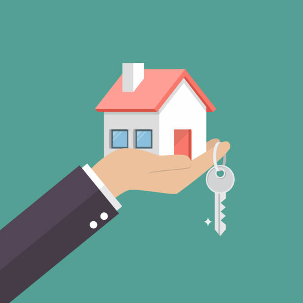 ręka trzymająca do domu w dłoni i klucz na palcu - mortgage stock illustrations