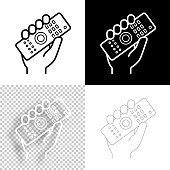 istock Hand holding up remote control. Icon for design. Blank, white and black backgrounds - Line icon 1389737089