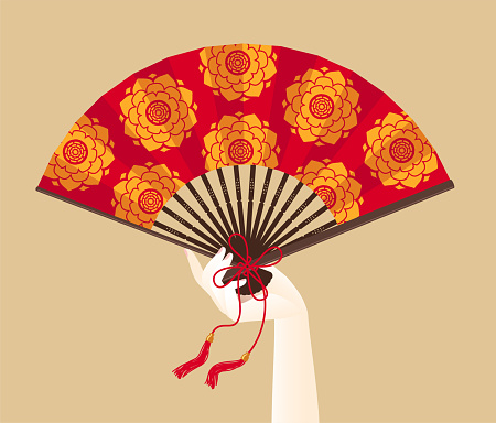 A hand of geisha holding a red fan