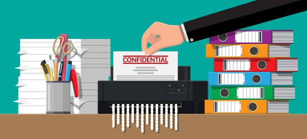 Hand putting document paper in shredder machine. Hand putting document paper in shredder machine. Torn to shreds document. Contract termination concept. Table with books, stationery, ring binder. Vector illustration in flat design destruction stock illustrations
