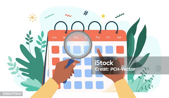 istock Hands with magnifier checking calendar 1285079340