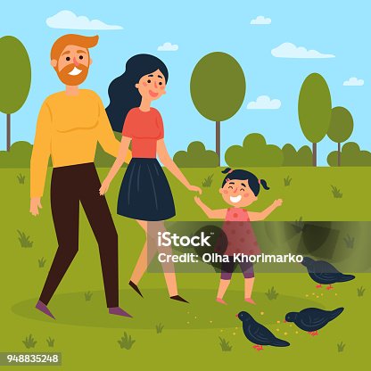 istock Happy family walks outdoors and feeds pigeons 948835248