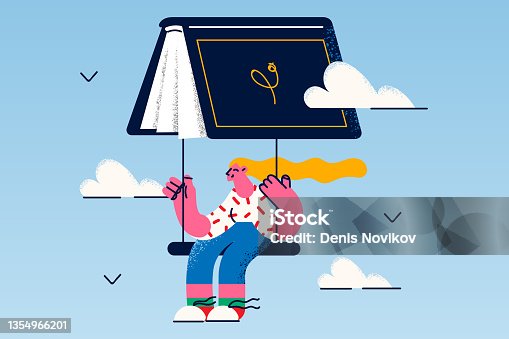 istock Happy girl reader fry on book as parachute 1354966201