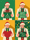 Christmas Characters Vector Art Illustration.
Happy handsome young doctor dressed in a Santa Claus suit holding a Christmas present and New Year greeting card and heart shape sign and digital tablet.