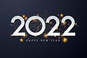 istock Happy New 2022 Year. Holiday vector illustration of golden metallic numbers 2022 and sparkling glitters pattern. Holiday greetings. 1343040134