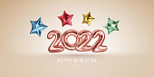 Happy New 2022 Year, rose gold number balloons and colorful stars modern design vector illustration