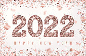Happy New Year 2022 Banner with glowing Rose Gold Numbers on white background with geometric frame confetti and flying foil paper. Vector illustration for design"n