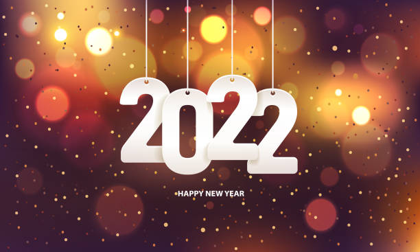 Happy new year 2022 Happy new year 2022. Hanging white paper number with confetti on a colorful blurry background. new years stock illustrations