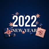 2022 Happy New Year banner. Flat Lay composition with gift boxes, shiny balls and star. Festive design for greeting cards, posters, sale etc.