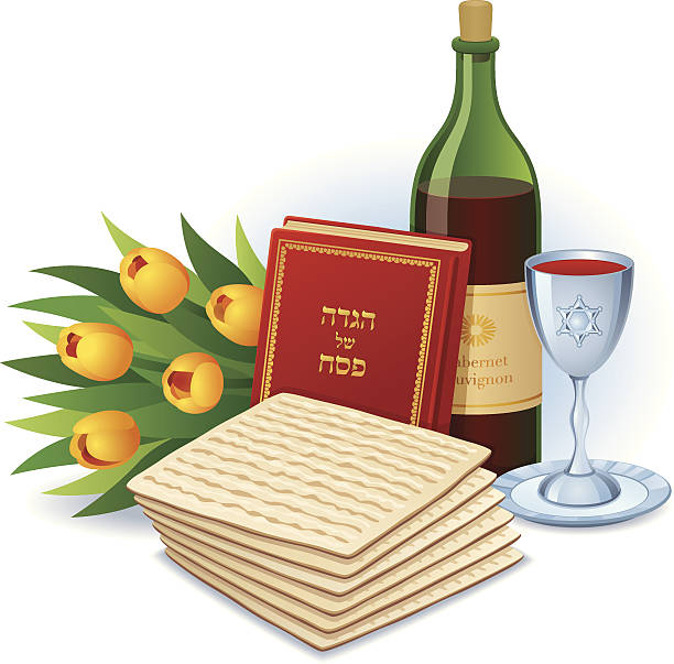 A colorful theme for the Jewish holiday of Passover, Including Matzoh (traditional unleavened bread), Haggadah (traditional text which is read during the Seder ceremony), A bottle of wine and a silver Kiddush cup. A bouquet of tulips adds decoration and hints that spring has arrived.  