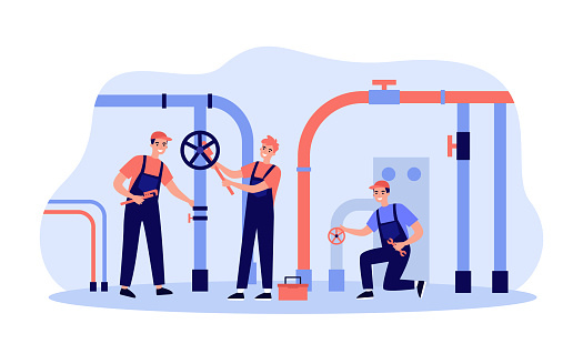 Happy plumbers fixing leakage in boiler room